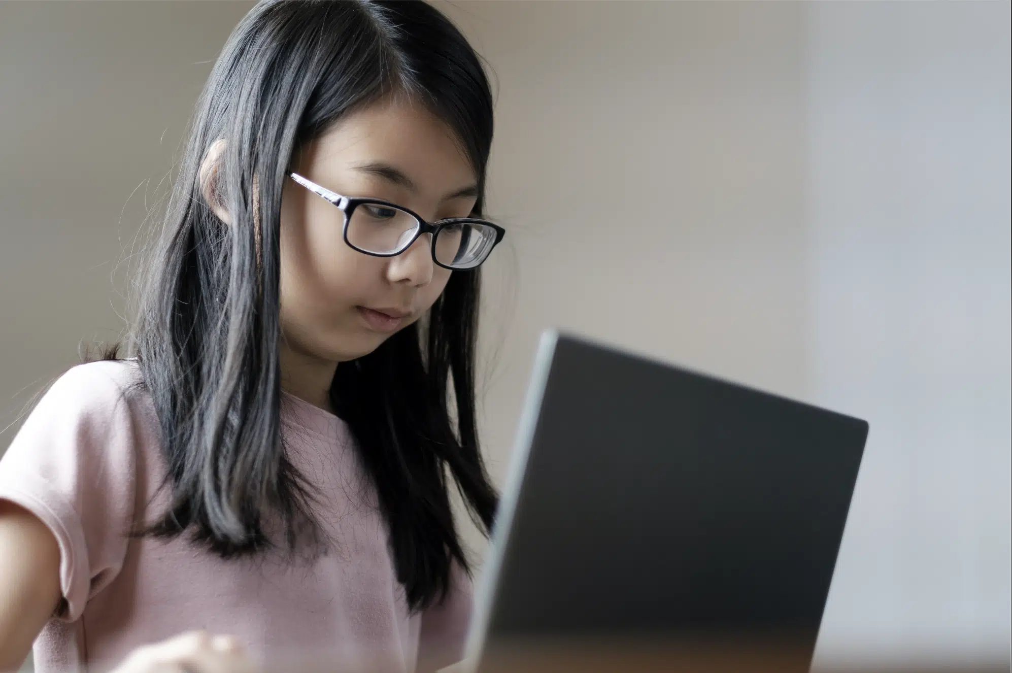 Young School Girl Using The Laptop